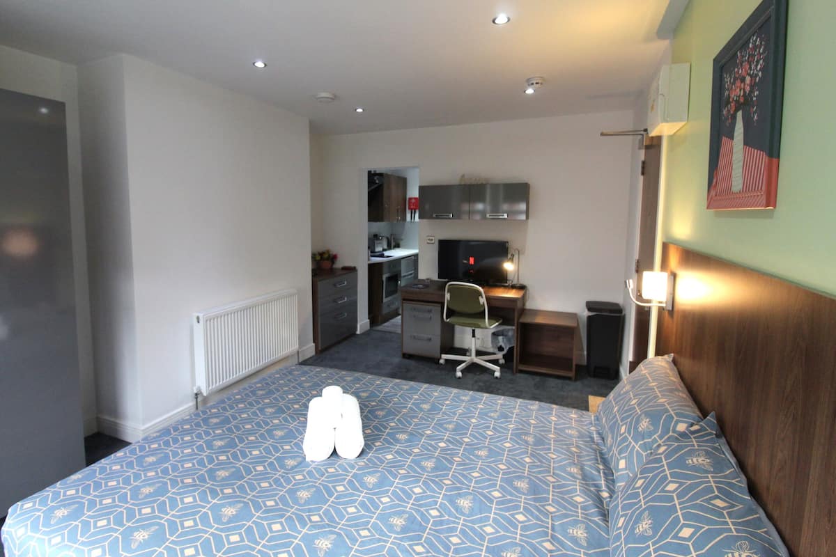 Premium bedding, down comforters, desk, laptop workspace