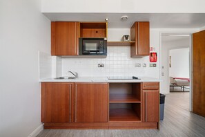 Fridge, microwave, oven, cookware/dishes/utensils
