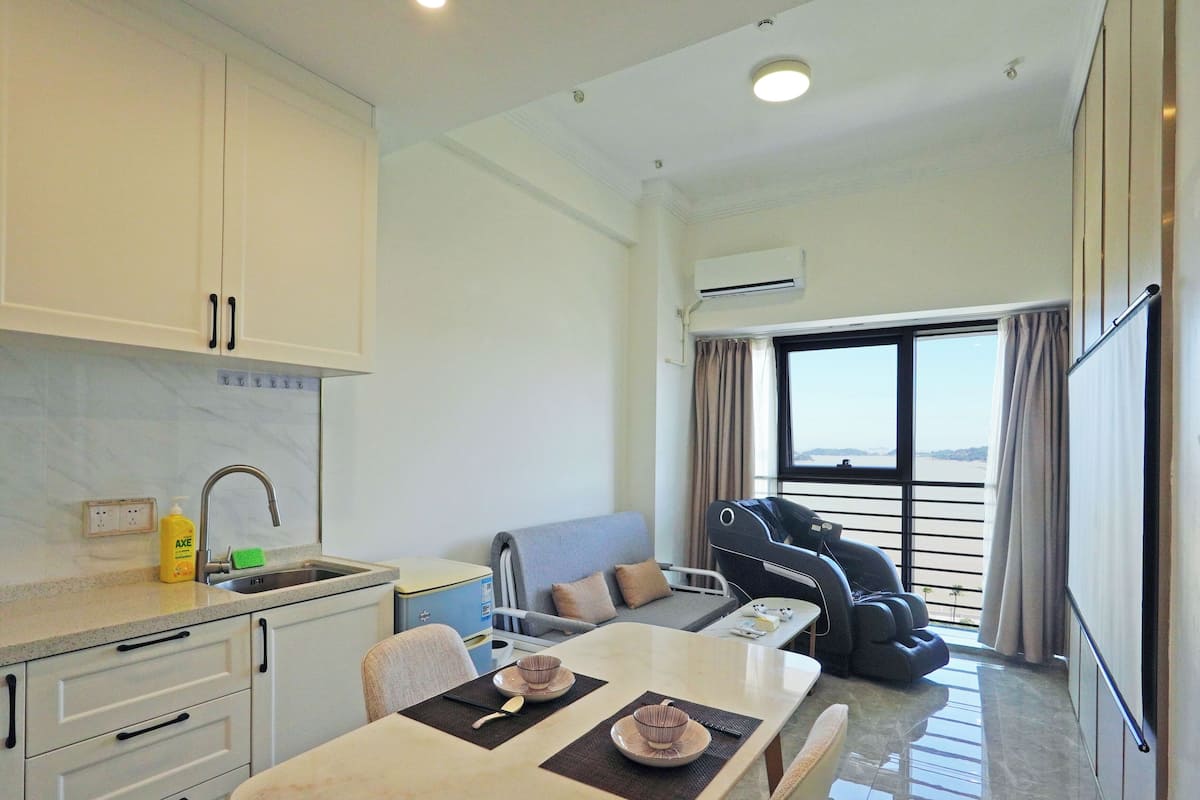 Classic Apartment, Ocean View | Living area | Video-game console