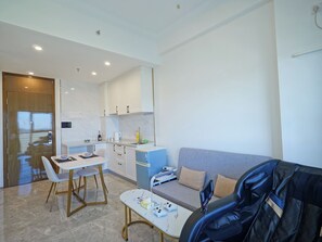 Classic Apartment, Ocean View | Living area | Video-game console