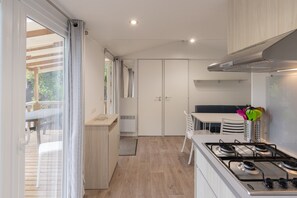 Fridge, microwave, stovetop, coffee/tea maker