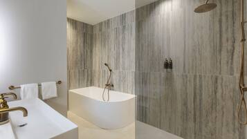 Junior Suite, Lake View | Bathroom | Designer toiletries, hair dryer, bathrobes, heated floors