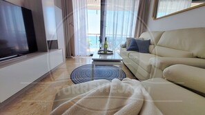 Apartamento superior, vista para o mar | Área de estar