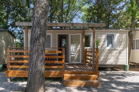 Exterior detail. Mobile Home 'Mobil-home B - 1-4 Persons' with Shared Pool, Private Terrace and Communal Garden