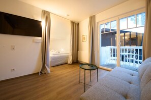 Comfort Apartment, 3 Bedrooms, Balcony, Mountain View | Living area | 50-inch flat-screen TV with cable channels