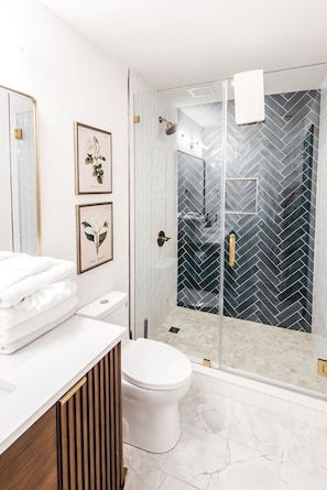 Shower, hair dryer, towels, soap
