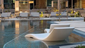 2 outdoor pools, open 10:00 AM to 6:00 PM, pool umbrellas, pool loungers