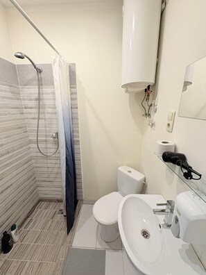 Hair dryer, towels, soap, shampoo