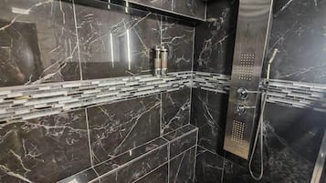 Shower, hair dryer, towels, soap
