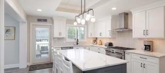 Easy to walk/bike to beach, restaurants & town. 4BR, 2.5 baths, Heated Pool.