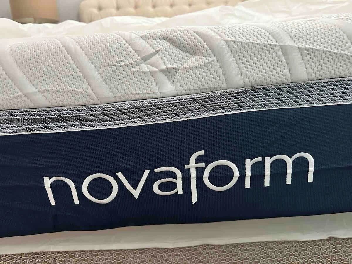 A pillow with the text 'novaform' on it.