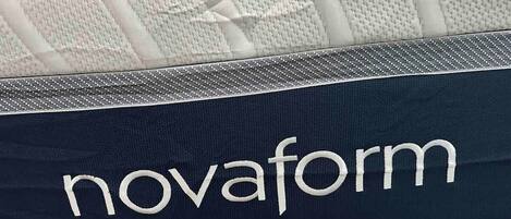 A pillow with the text 'novaform' on it.