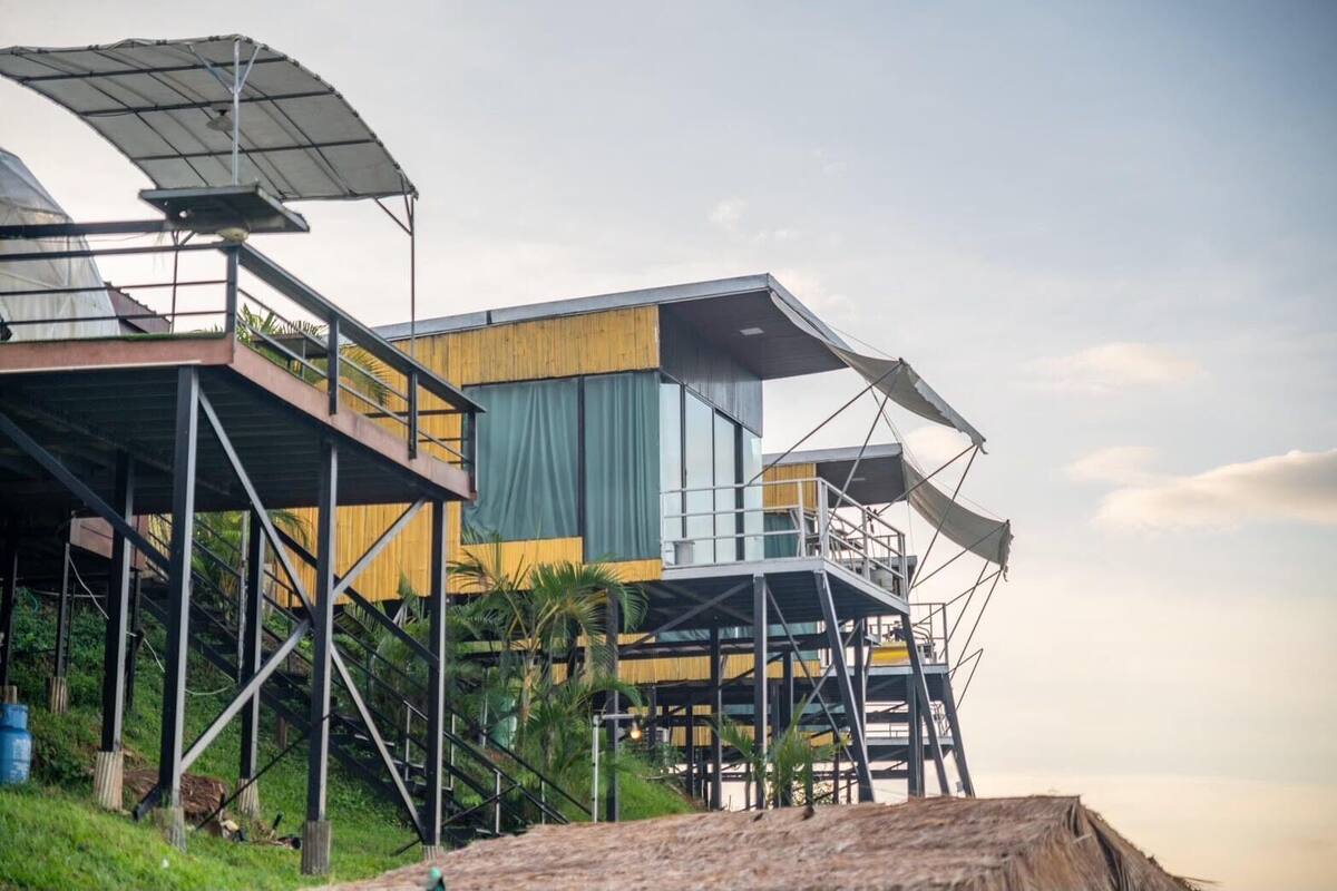 A multi-level outdoor structure with a modern design, featuring a series of platforms and covered areas, likely intended for outdoor activities or relaxation.