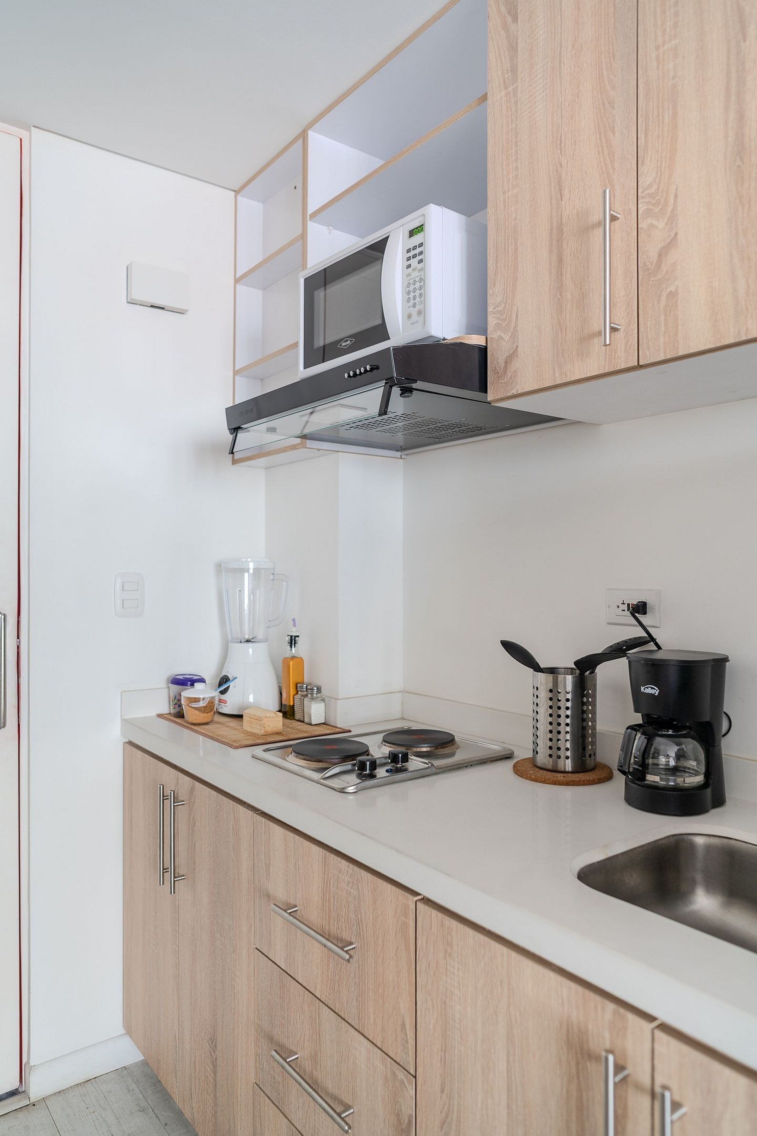 Coffee/tea maker, fridge, cookware/dishes/utensils