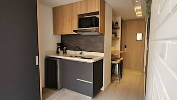 Fridge, microwave, coffee/tea maker, cookware/dishes/utensils