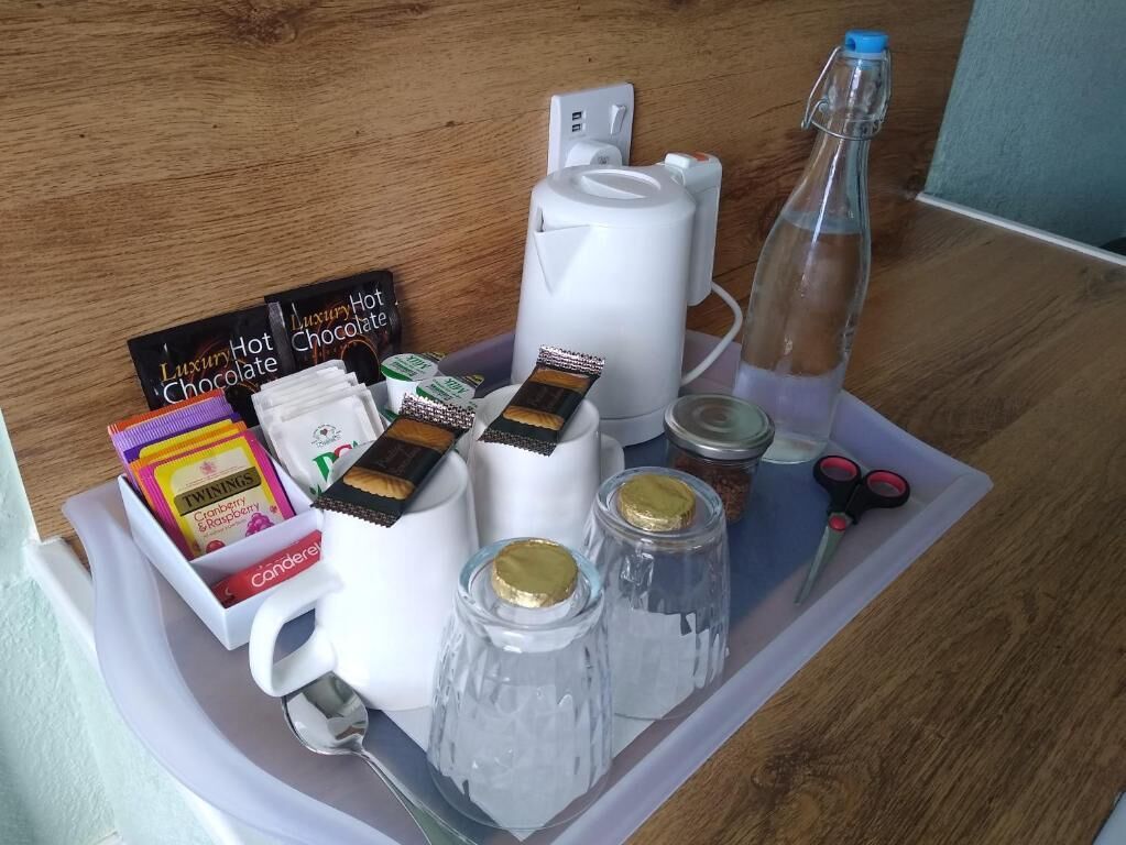 A tray with luxury hot chocolate, TWININGS, and a water bottle.