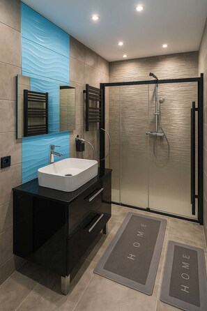 Shower, free toiletries, hair dryer, towels