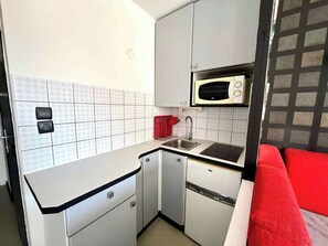 Fridge, microwave, coffee/tea maker, cookware/dishes/utensils