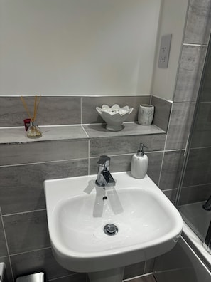 Hair dryer, towels, soap, toilet paper