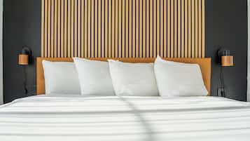 Desk, iron/ironing board, travel crib, bed sheets