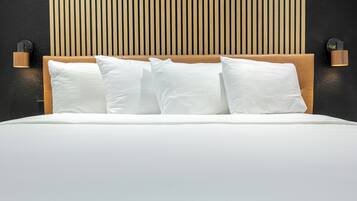 Desk, iron/ironing board, travel crib, bed sheets