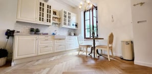 Fridge, microwave, coffee/tea maker, cookware/dishes/utensils