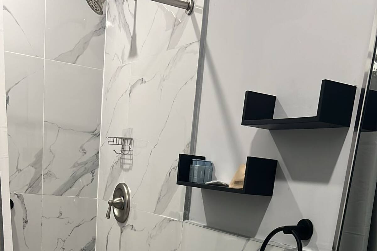 Shower, hair dryer, towels, soap