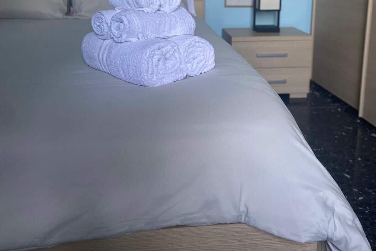 Deluxe Apartment, Balcony, Mountain View | Hypo-allergenic bedding, blackout drapes, iron/ironing board, free WiFi