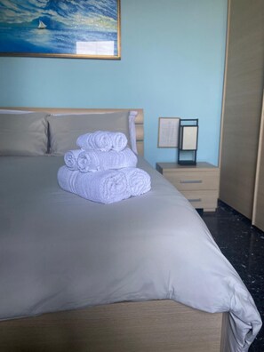 Deluxe Apartment, Balcony, Mountain View | Hypo-allergenic bedding, blackout drapes, iron/ironing board, free WiFi