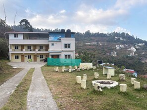 A multi-story building with a sign reading 'Kodai Hillscape.' - Kodai Hillscape (Kodaikanal)