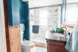 Shower, towels, soap, toilet paper