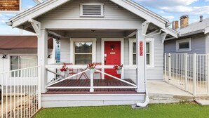 A house with a red door, white porch, and a number '219' on the wall. - The Horseshoe Hideaway - Rodeo Themed & 1/2 mile walk to Whiskey Row! (Prescott)