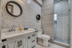 Shower, hair dryer, towels, soap