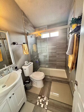 Shower, hair dryer, towels, soap