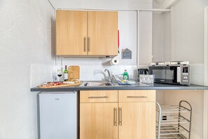 Fridge, microwave, toaster, cookware/dishes/utensils