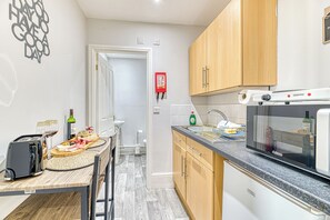 Fridge, microwave, toaster, cookware/dishes/utensils