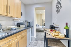 Fridge, microwave, toaster, cookware/dishes/utensils