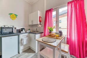 Fridge, microwave, toaster, cookware/dishes/utensils