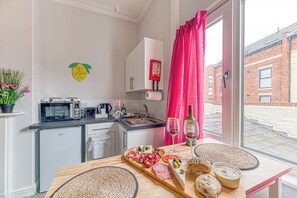 Fridge, microwave, toaster, cookware/dishes/utensils