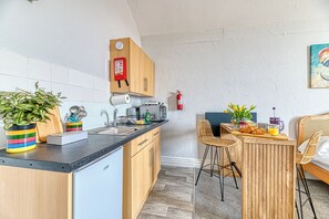 Fridge, microwave, toaster, cookware/dishes/utensils