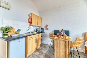 Fridge, microwave, toaster, cookware/dishes/utensils