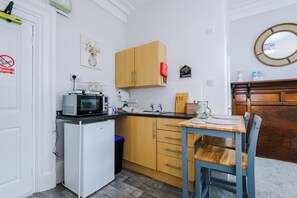 Fridge, microwave, toaster, cookware/dishes/utensils