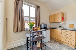 Fridge, microwave, toaster, cookware/dishes/utensils