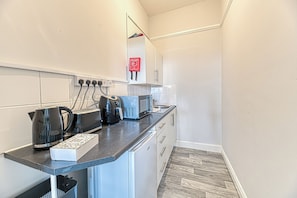 Fridge, microwave, toaster, cookware/dishes/utensils