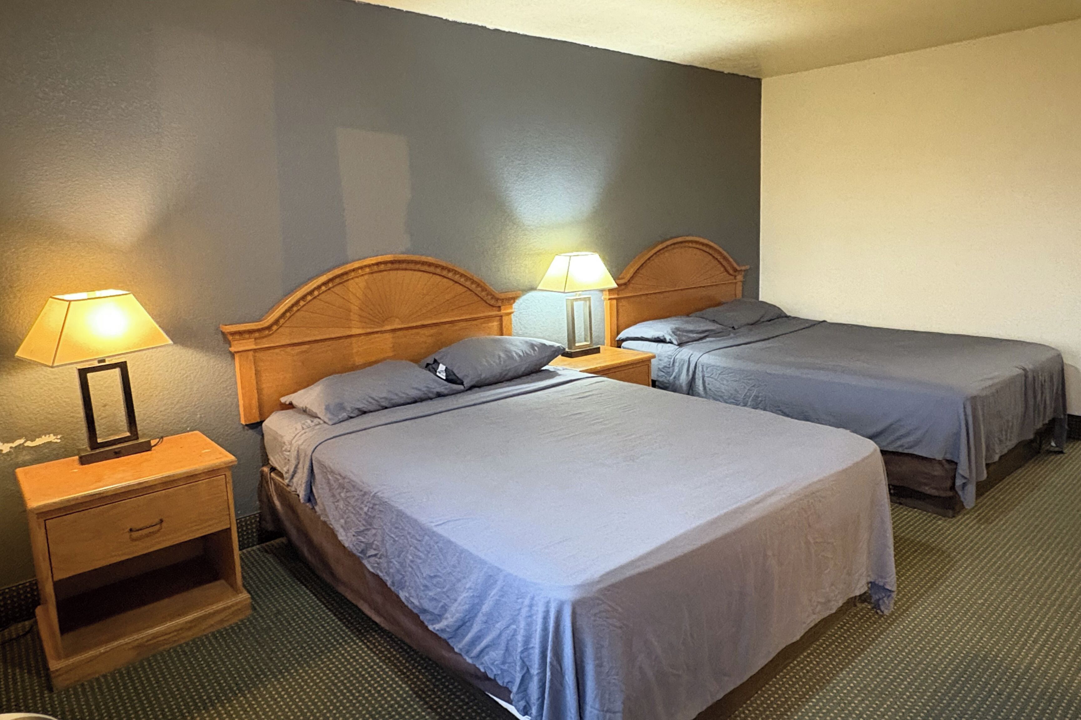 Room, 2 Queen Beds, Smoking | In-room safe, iron/ironing board, free WiFi, bed sheets