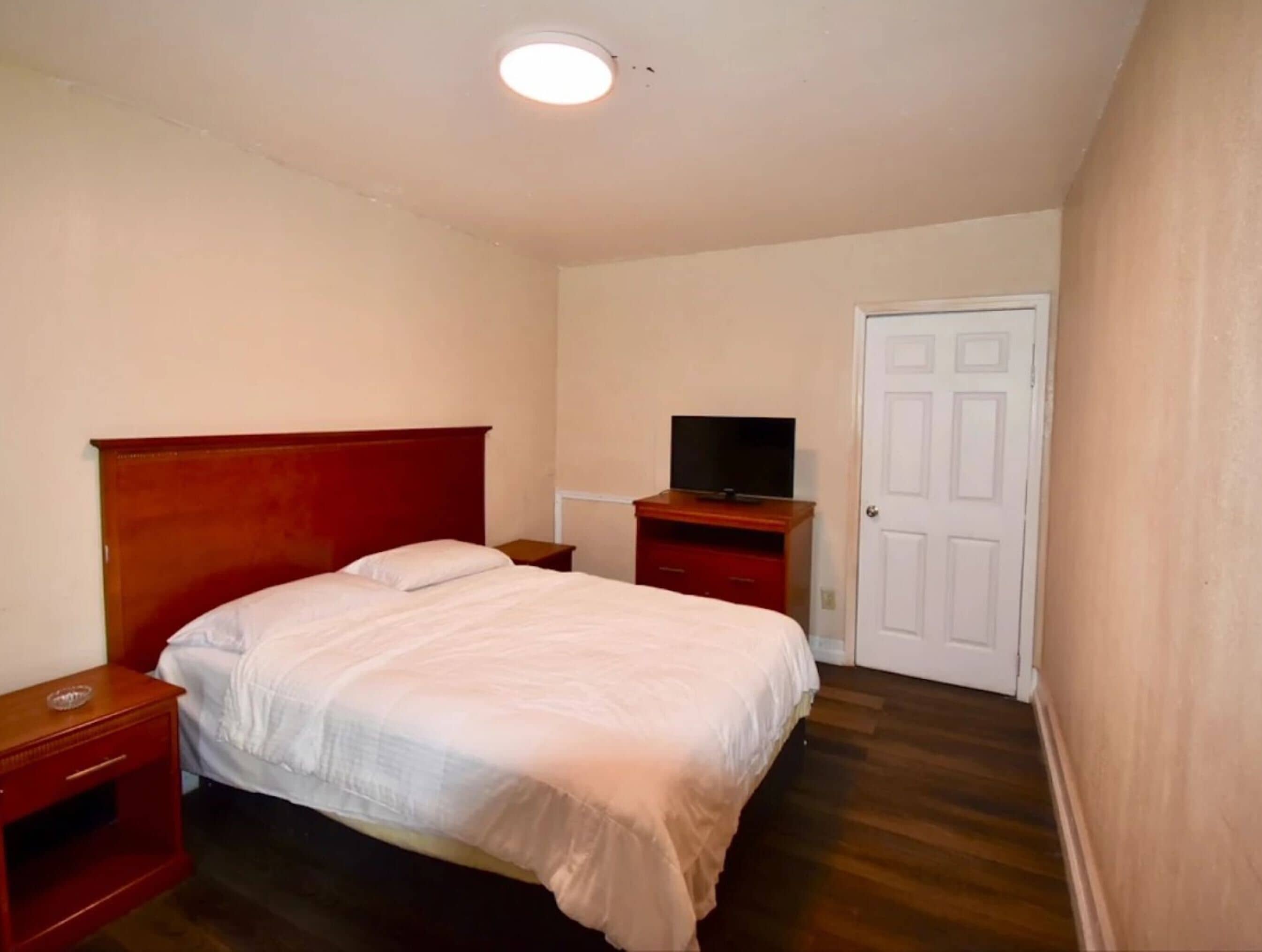 Room, 2 Queen Beds, Smoking | In-room safe, iron/ironing board, free WiFi, bed sheets