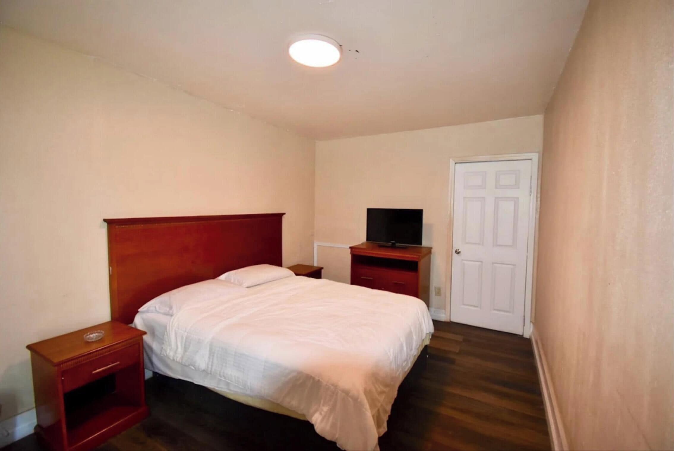 Room, 2 Queen Beds, Smoking | In-room safe, iron/ironing board, free WiFi, bed sheets