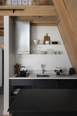 Fridge, coffee/tea maker, toaster, cookware/dishes/utensils