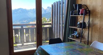 South-facing, large living room, mountain views and private covered parking.