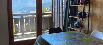 South-facing, large living room, mountain views and private covered parking.